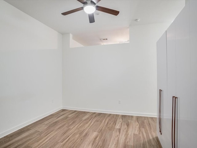 unfurnished room with light hardwood / wood-style floors and ceiling fan