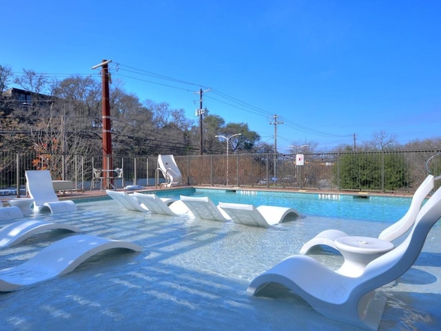 view of pool featuring a water slide