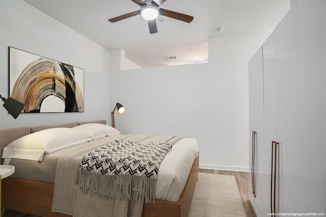 bedroom featuring ceiling fan and light hardwood / wood-style floors