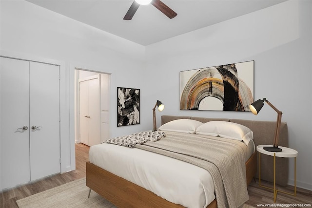 bedroom featuring a closet, ceiling fan, and hardwood / wood-style floors