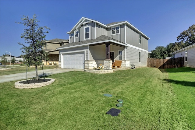 view of front facade with a garage and a front lawn