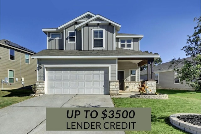 view of front of house featuring a garage and a front lawn