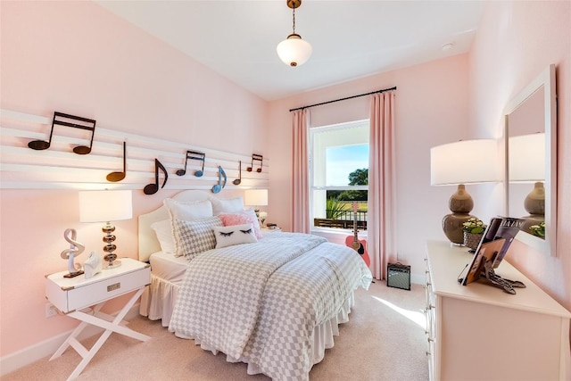 bedroom featuring light colored carpet