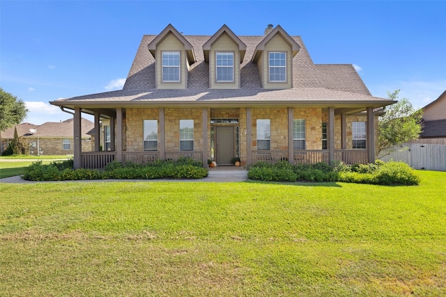 view of front of house featuring a front lawn and covered porch