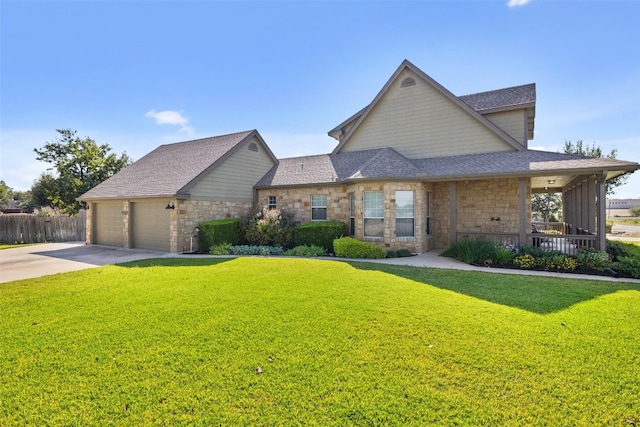 view of front of home featuring a garage and a front lawn