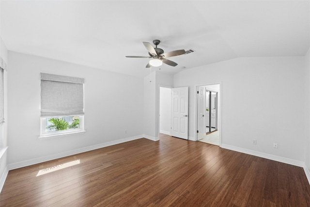 unfurnished room featuring ceiling fan, dark hardwood / wood-style flooring, and vaulted ceiling