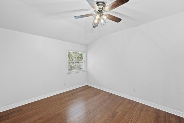 spare room with lofted ceiling, ceiling fan, and wood-type flooring