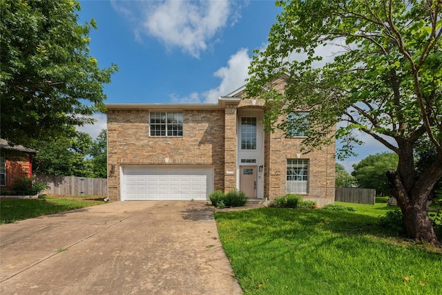 view of front of house with a front lawn and a garage