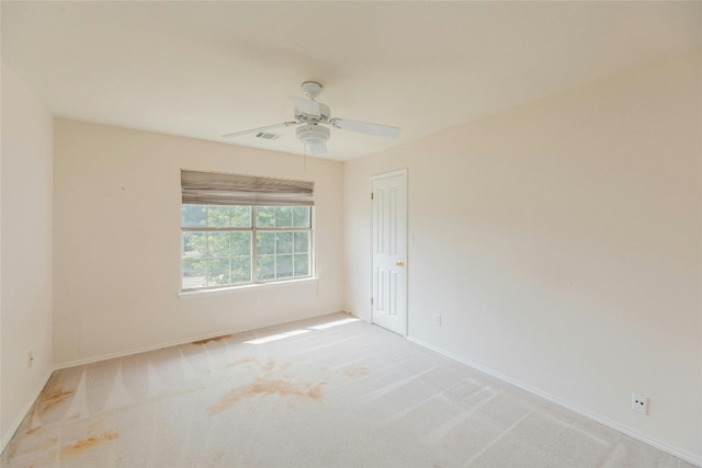 carpeted empty room with ceiling fan