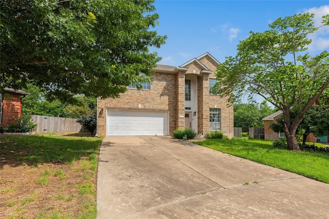 view of front of property with a garage and a front lawn