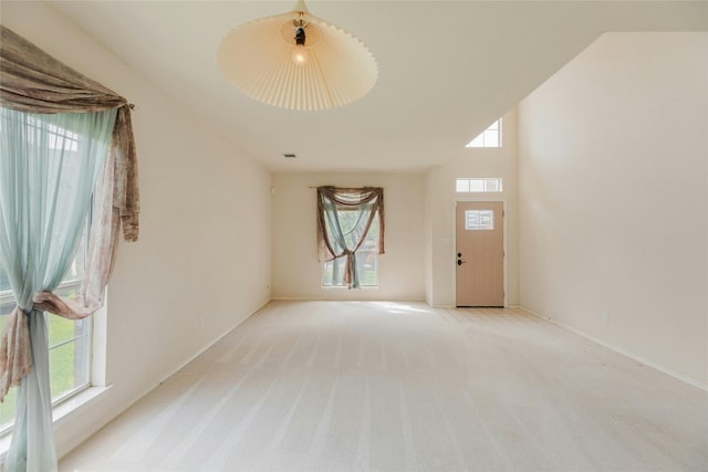 interior space featuring light colored carpet