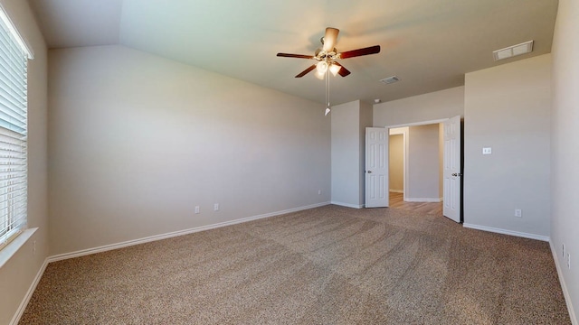 unfurnished bedroom with vaulted ceiling, ceiling fan, and carpet flooring