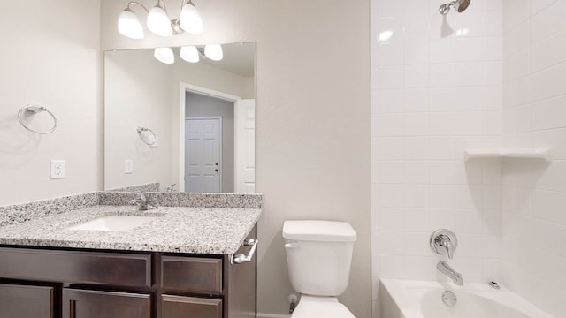 full bathroom with vanity, toilet, and tiled shower / bath