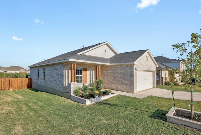 view of front of house with a front yard and a garage