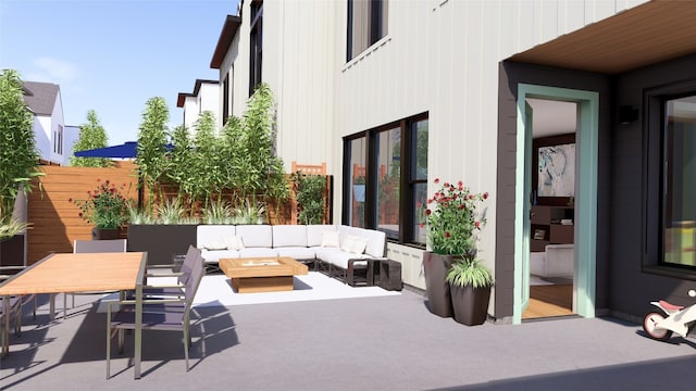 view of patio with an outdoor living space with a fire pit