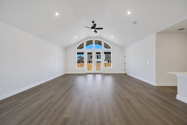 unfurnished living room with dark wood-type flooring, french doors, ceiling fan, and vaulted ceiling