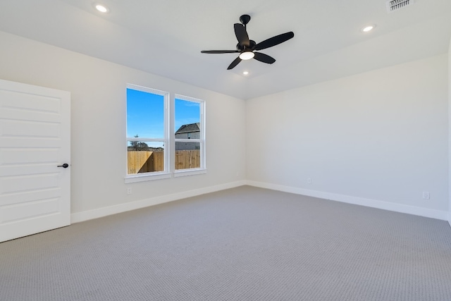 spare room with ceiling fan and carpet flooring