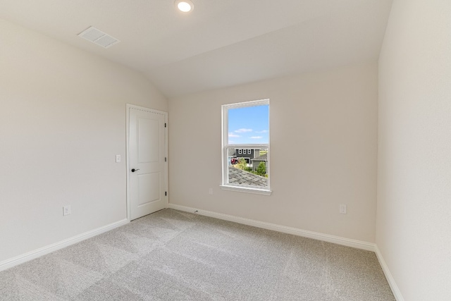 8508 Dongan Dr, Austin, TX 78744 - unfurnished room with light carpet and vaulted ceiling