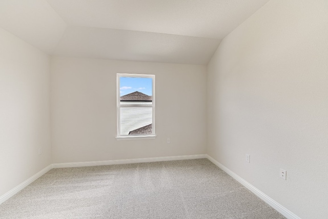 8508 Dongan Dr, Austin, TX 78744 - spare room with light colored carpet and lofted ceiling