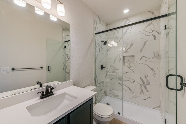 8508 Dongan Dr, Austin, TX 78744 - bathroom featuring vanity, a marble finish shower, and recessed lighting