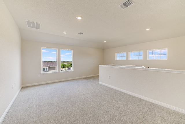 8508 Dongan Dr, Austin, TX 78744 - unfurnished room with light carpet and recessed lighting