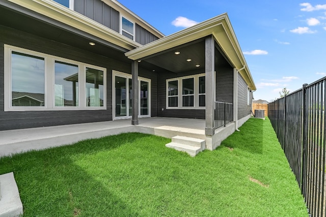 8508 Dongan Dr, Austin, TX 78744 - rear view of house featuring board and batten siding and a patio area