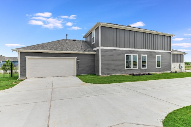 8508 Dongan Dr, Austin, TX 78744 - view of front facade featuring driveway, a garage, and board and batten siding