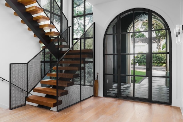 1510 Pease Rd, Austin, TX 78703 - staircase with wood finished floors and french doors