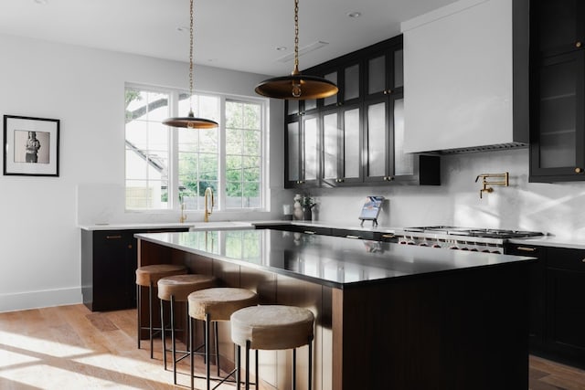 kitchen with light wood-type flooring and a kitchen island