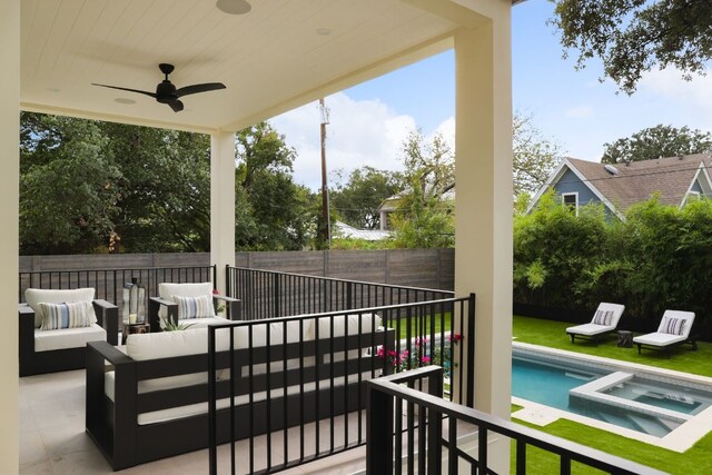 view of patio with a pool with hot tub, an outdoor living space, and ceiling fan