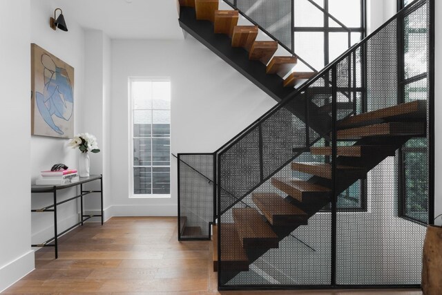 staircase featuring wood-type flooring