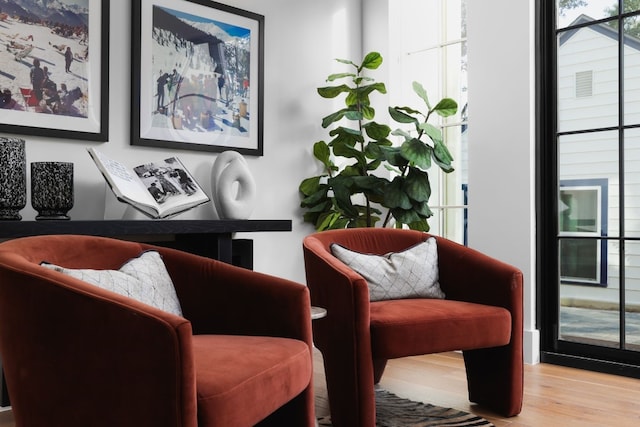 sitting room with light hardwood / wood-style floors