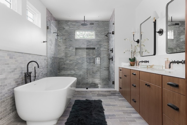 bathroom featuring shower with separate bathtub, vanity, and hardwood / wood-style flooring