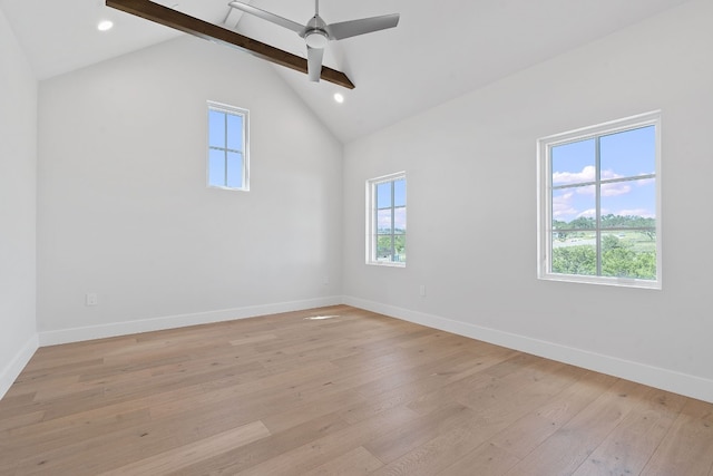 empty room featuring ceiling fan, vaulted ceiling with beams, and light hardwood / wood-style flooring