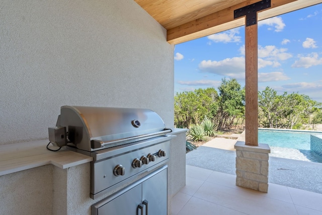 view of patio / terrace with area for grilling and an outdoor kitchen