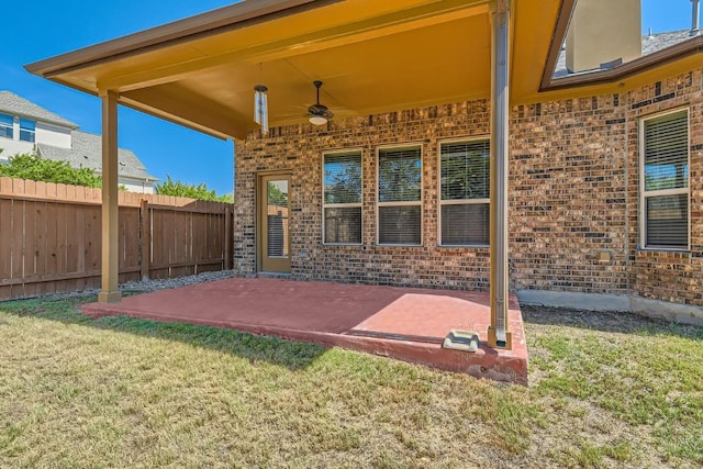 view of patio featuring fence and ceiling fan