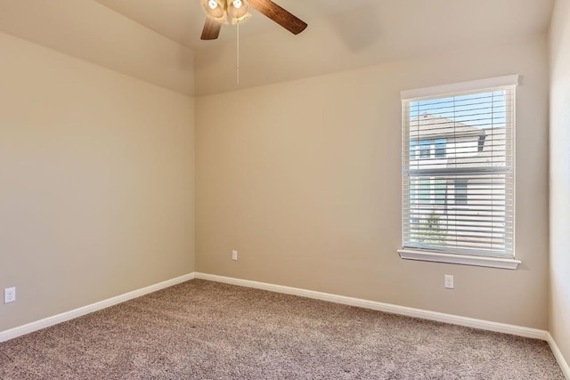 unfurnished room featuring ceiling fan, carpet floors, and baseboards