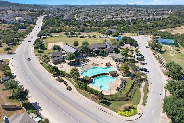 birds eye view of property with a residential view