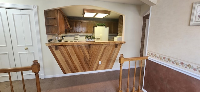 bar featuring white fridge with ice dispenser