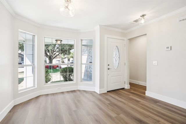 entrance foyer featuring light wood-type flooring and ornamental molding