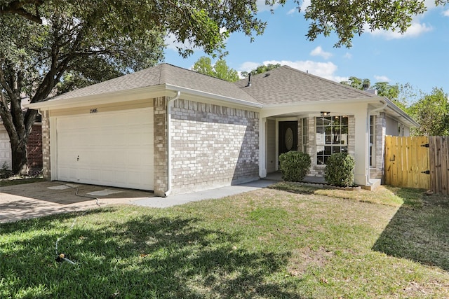 single story home with a garage and a front lawn