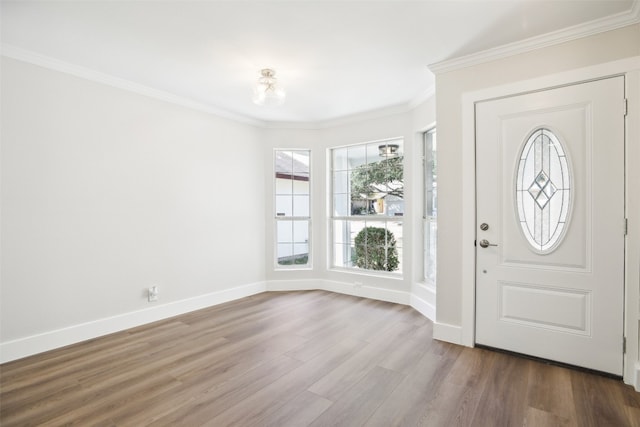 foyer featuring hardwood / wood-style flooring and crown molding