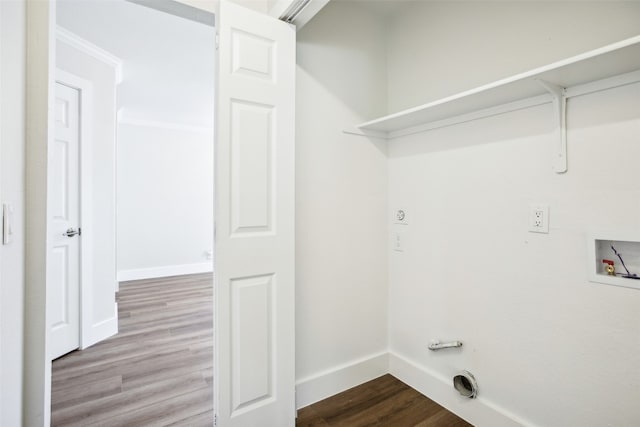 clothes washing area featuring light wood-type flooring