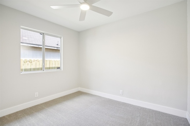 empty room featuring carpet floors and ceiling fan