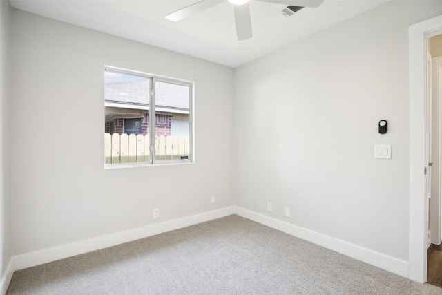 unfurnished room featuring carpet and ceiling fan