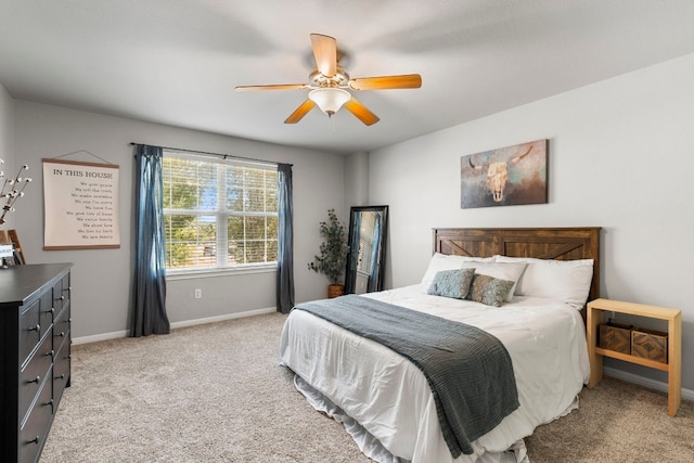 7709 Little Deer Trl, Georgetown, TX 78628 - bedroom with baseboards, light carpet, and ceiling fan