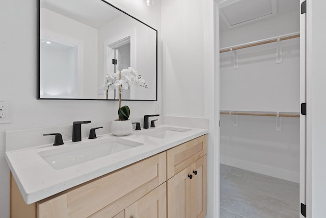 bathroom featuring tile patterned flooring and vanity