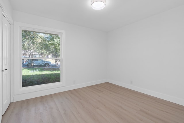 spare room featuring light hardwood / wood-style floors