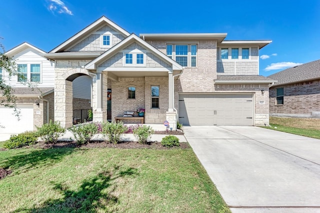 view of front of house featuring a front yard and a garage