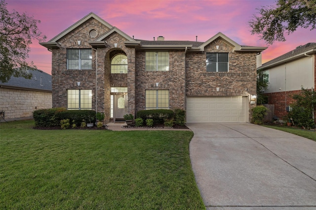 view of property featuring a garage and a yard